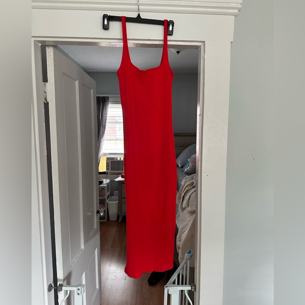 Red dress, skinny straps, knee length, below the knee